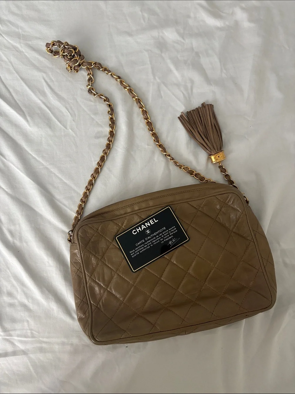 CHANEL Quilted Brown Leather Shoulder Bag with Gold-Tone Chain & Tassel